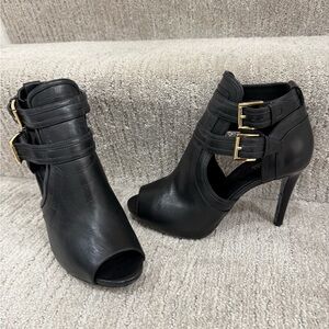 Vince Camuto Black and Gold Ankle Boots with Chic Cut-Out Design